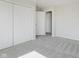 Neutral bedroom featuring closet doors and plush carpeting at 5672 High Timber Ln, Indianapolis, IN 46235