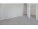 A neutral bedroom offers a walk-in closet and ensuite bathroom entrance for privacy and convenience at 5672 High Timber Ln, Indianapolis, IN 46235