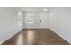 Bright entryway features hardwood floors, two windows, and a white front door at 5672 High Timber Ln, Indianapolis, IN 46235