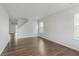 A spacious living room is illuminated by natural light from the room's many windows at 5672 High Timber Ln, Indianapolis, IN 46235