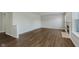 Bright living room featuring hardwood floors and a decorative fireplace at 5672 High Timber Ln, Indianapolis, IN 46235