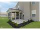 Back exterior featuring a screen porch at 5672 High Timber Ln, Indianapolis, IN 46235