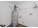 A utility closet features a modern A.O. Smith water heater, shelving, and plumbing at 5672 High Timber Ln, Indianapolis, IN 46235