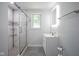 Modern bathroom with glass shower, vanity, and illuminated mirror at 5902 Oak Ln, Anderson, IN 46013