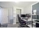 Small bedroom with grey walls, gaming setup and modern computer equipment at 5902 Oak Ln, Anderson, IN 46013