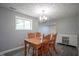 Bright dining room with wooden table, chairs, and stylish lighting at 5902 Oak Ln, Anderson, IN 46013