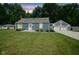 Charming blue home with a well-maintained lawn and a detached two-car garage at 5902 Oak Ln, Anderson, IN 46013