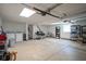 Spacious garage with ample room for parking and storage, plus visible washer and dryer at 5902 Oak Ln, Anderson, IN 46013
