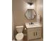 Bathroom featuring a modern hexagon mirror, vanity, and toilet at 5993 E County Road 100 S, Avon, IN 46123