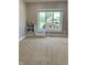 Spacious bedroom with neutral carpet and large window overlooking a well-maintained yard at 5993 E County Road 100 S, Avon, IN 46123