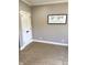Bedroom featuring neutral carpeting, a framed scripture, and a white door at 5993 E County Road 100 S, Avon, IN 46123