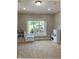 Neutral carpeted room with natural light from a large window, ideal for a playroom or spare bedroom at 5993 E County Road 100 S, Avon, IN 46123