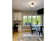Breakfast nook with table and chairs, bright windows and view of backyard, cabinets, and hardwood floors at 5993 E County Road 100 S, Avon, IN 46123
