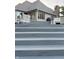 Beautiful gray deck with steps up to outdoor seating and views of the home's exterior at 5993 E County Road 100 S, Avon, IN 46123