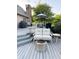 Spacious deck area with outdoor furniture, grill, and a cozy fire pit perfect for entertaining at 5993 E County Road 100 S, Avon, IN 46123