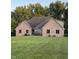 Charming brick home with well-manicured lawn and mature landscaping in front at 5993 E County Road 100 S, Avon, IN 46123