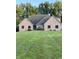 Charming brick home with a lush lawn, and a well-manicured yard, offering great curb appeal at 5993 E County Road 100 S, Avon, IN 46123