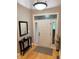 Inviting foyer with hardwood floors, decorative glass door, and stylish furnishings creating a warm welcome at 5993 E County Road 100 S, Avon, IN 46123