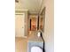 Hallway featuring neutral decor, a dresser, a mirror, and an open door with a staircase at 5993 E County Road 100 S, Avon, IN 46123