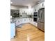 A kitchen featuring white cabinets, granite countertops, stainless steel appliances and hardwood floors at 5993 E County Road 100 S, Avon, IN 46123