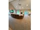 Bright living room features fireplace, TV, high ceilings, recessed lights, and sliding doors to the outside at 5993 E County Road 100 S, Avon, IN 46123