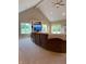 Comfortable living room featuring a large sectional, vaulted ceilings, and windows with scenic views at 5993 E County Road 100 S, Avon, IN 46123