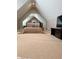 Spacious carpeted main bedroom with large bed, television and mirrored wall at 5993 E County Road 100 S, Avon, IN 46123
