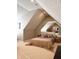 Spacious main bedroom with large bed, mirrored wall, carpet and angled ceiling at 5993 E County Road 100 S, Avon, IN 46123