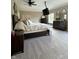 Spacious main bedroom features neutral paint and carpet, a ceiling fan, and two accent mirrors at 5993 E County Road 100 S, Avon, IN 46123