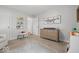 A bright Bedroom with neutral decor, dresser, whale art and soft carpet at 6009 Ralston Ave, Indianapolis, IN 46220