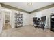 Bedroom with neutral carpet, white walls, and a desk area perfect for a home office at 6009 Ralston Ave, Indianapolis, IN 46220