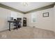 Bedroom with neutral carpet, white walls, and a desk area perfect for a home office at 6009 Ralston Ave, Indianapolis, IN 46220