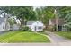 Charming single Gathering home with detached garage, mature trees and a well-manicured lawn at 6009 Ralston Ave, Indianapolis, IN 46220