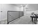 Hallway with neutral carpet and iron railing at 6009 Ralston Ave, Indianapolis, IN 46220