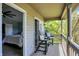 Inviting balcony with two chairs, providing a serene outdoor space accessible from the main bedroom at 6298 Briargate Dr, Zionsville, IN 46077