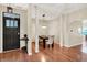 Elegant dining room with hardwood floors, stylish lighting, and a modern table setting at 6298 Briargate Dr, Zionsville, IN 46077