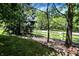 Exterior shot of a property showing a well-maintained lawn and a white picket fence at 6298 Briargate Dr, Zionsville, IN 46077