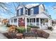 Charming two-story building, 'The Scoop' with a welcoming porch and seasonal decorations at 6298 Briargate Dr, Zionsville, IN 46077