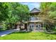 Two story home featuring a double-deck porch and a well-manicured lawn at 6298 Briargate Dr, Zionsville, IN 46077