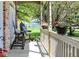 Inviting front porch with rocking chairs, plants and flowerpots at 6298 Briargate Dr, Zionsville, IN 46077
