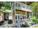 Close-up of the inviting front porch with double French doors and comfortable seating at 6298 Briargate Dr, Zionsville, IN 46077