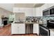 Updated kitchen featuring stainless appliances, granite countertops and a view to the living area at 6298 Briargate Dr, Zionsville, IN 46077