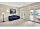Inviting living room featuring double French doors, offering seamless access to the outdoor space at 6298 Briargate Dr, Zionsville, IN 46077