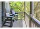 Relaxing porch featuring comfortable Adirondack chairs and a serene view of the surrounding trees at 6298 Briargate Dr, Zionsville, IN 46077