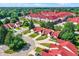 Panoramic aerial view of a tranquil residential community with lush green landscaping and beautiful red roofs at 6402 Friendship Cir, Indianapolis, IN 46268