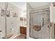 Bathroom featuring a glass-enclosed shower and neutral decor at 6402 Friendship Cir, Indianapolis, IN 46268
