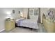Bright bedroom featuring a large window and light-colored decor at 6402 Friendship Cir, Indianapolis, IN 46268