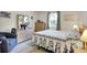 Comfortable bedroom with a floral bedspread, light wood furniture, and a large window at 6402 Friendship Cir, Indianapolis, IN 46268