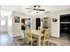Bright dining room featuring neutral walls, hardwood floors, with dining set at 6402 Friendship Cir, Indianapolis, IN 46268