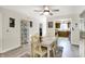 Bright dining room featuring neutral walls, hardwood floors, with dining set at 6402 Friendship Cir, Indianapolis, IN 46268